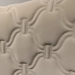 Cream Quilted Upholstered Bed with Patterned Stitching & Gold Stainless Steel Accents